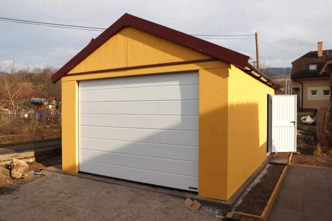 Eine Satteldach-Garage in dunkel-gelb